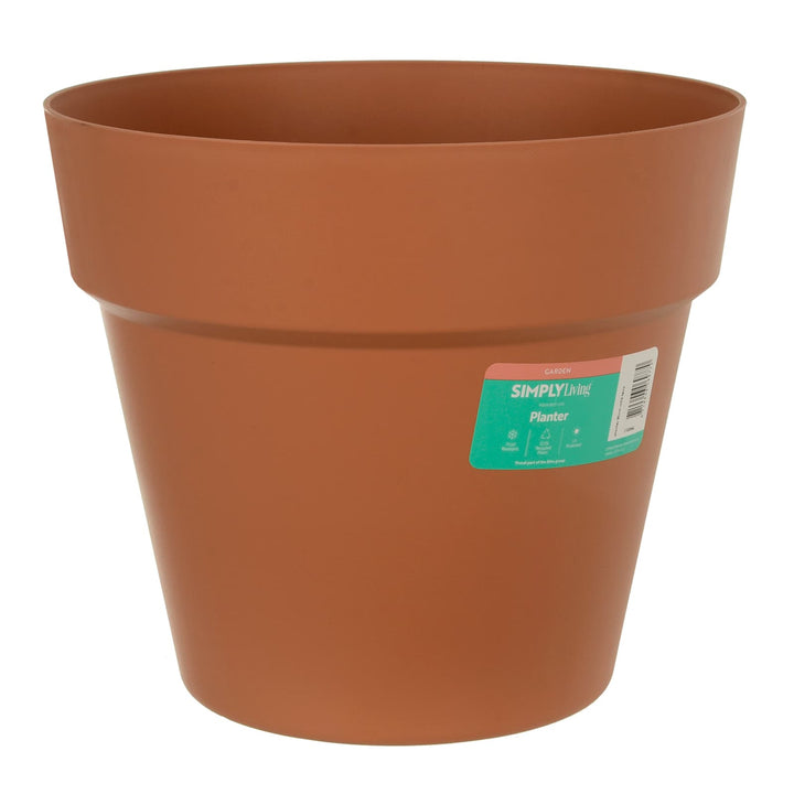 Round terracotta garden planter in plastic