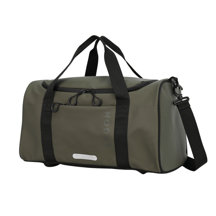 side view of olive green hodge and hodhe duffle bag with black carry handles and reflective details on the front