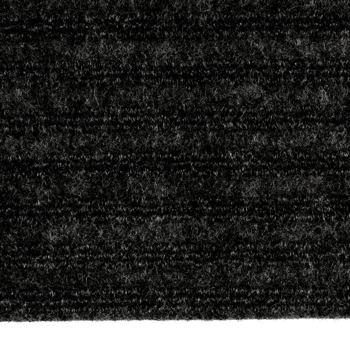 Detail of a black ridged door mat for indoor use