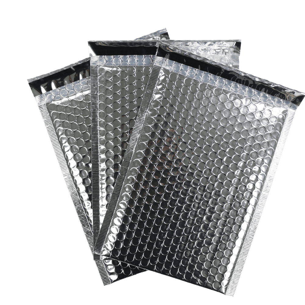 set of 3 silver self sealing bubble mailers on white background