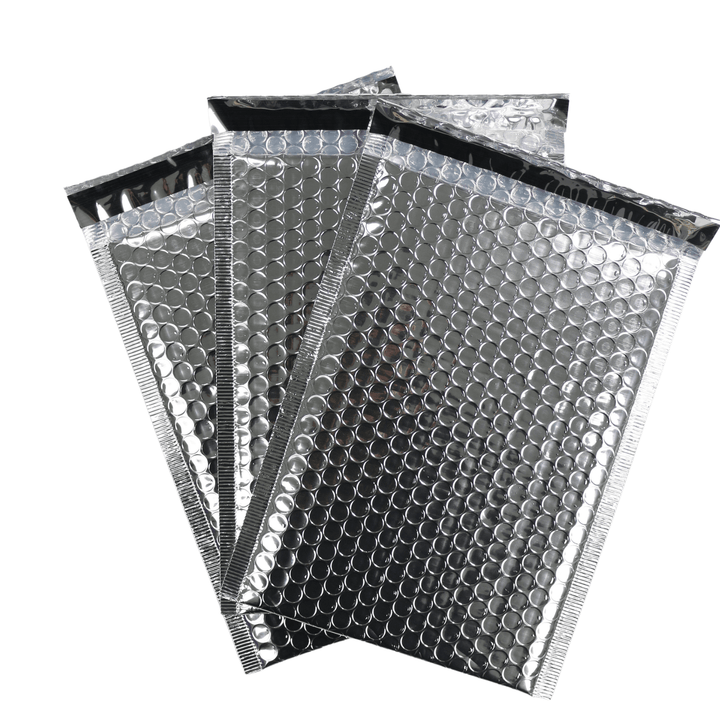 set of 3 silver self sealing bubble mailers on white background