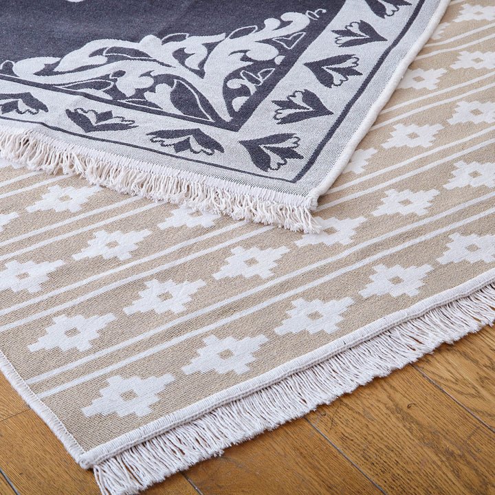 Natural colour geometric pattern reversible rug with black and white back