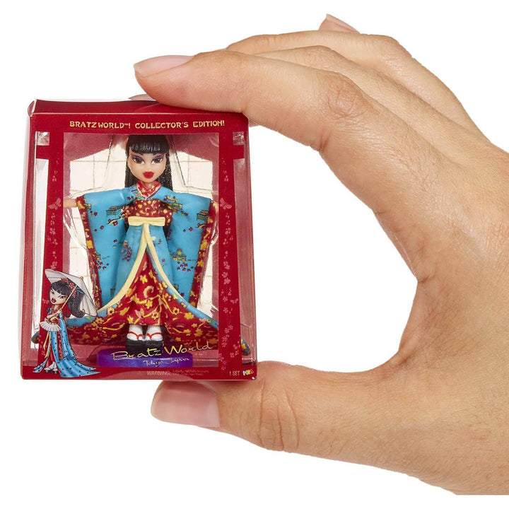 Hand holding a collectible Bratz mini figure in packaging
