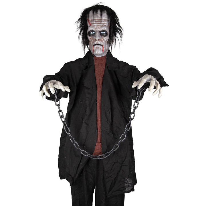 Close up of Frankie Monster animated Halloween decoration with wrist shackles