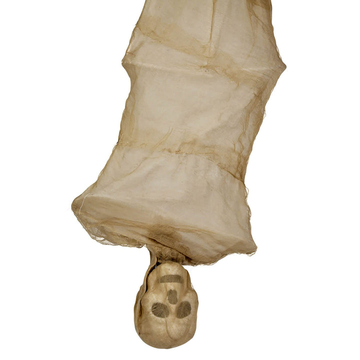 Close up of the skull head of an animated hanging mummy decoration for Halloween