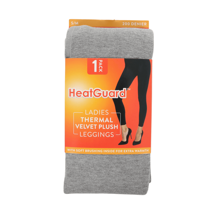 Packaged gray thermal leggings with HeatGuard branding on an orange background