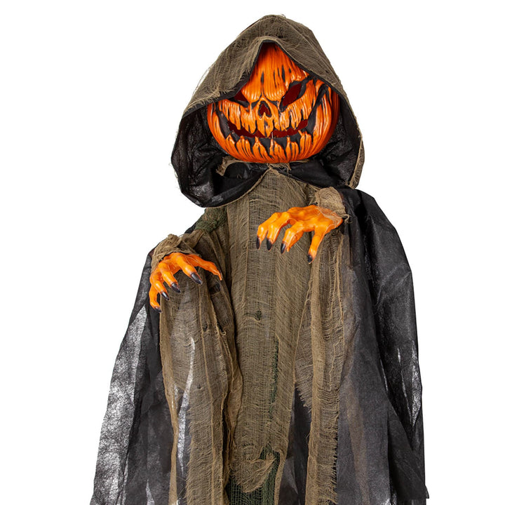 Halloween hanging figure with orange pumpkin head and skeleton hands