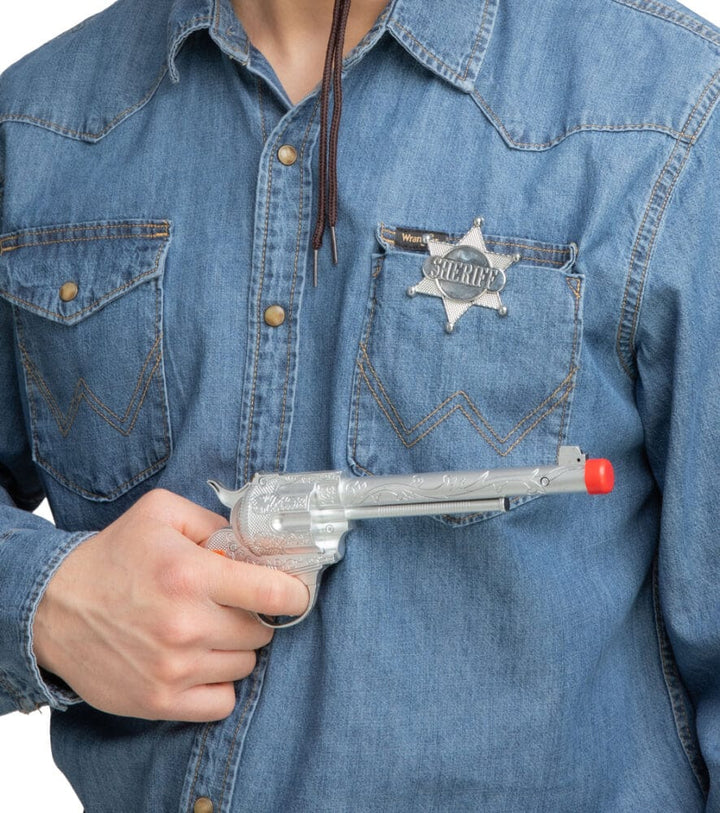 Person wearing a blue shirt with sheriff star badge and pretend cowboy gun