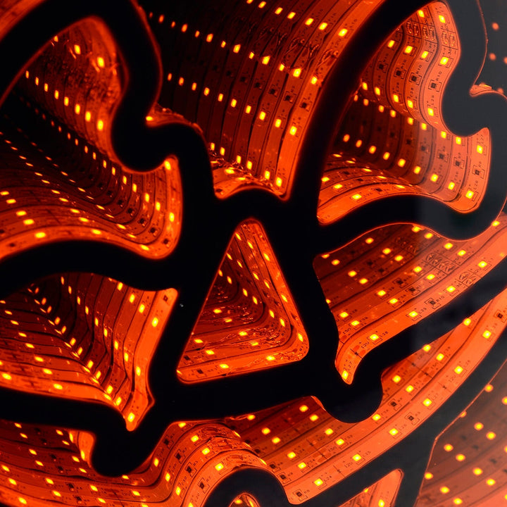 Close up of an infinity mirror pumpkin light