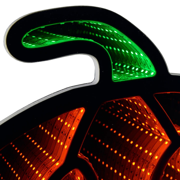 Detail of a green and orange LED pumpkin infinity mirror light