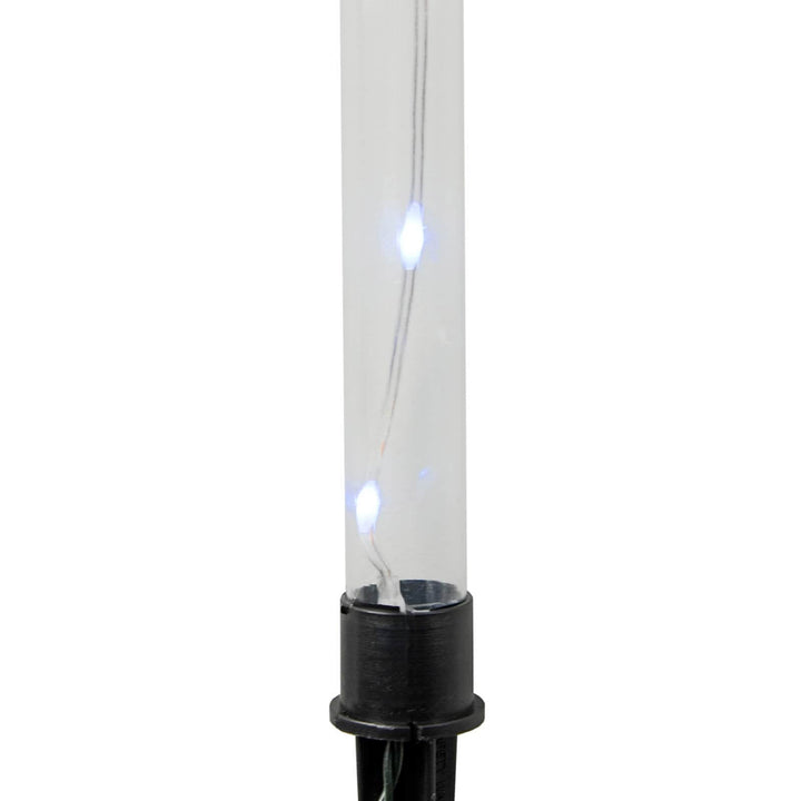 Close up of a white light in a plastic tube with stake