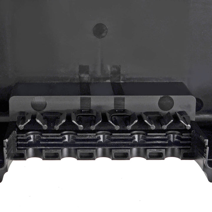 Close up of cable grippers in a back electrical enclosure box