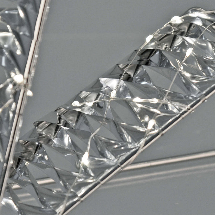 Close up of white lights on an aluminium wrapped frame star