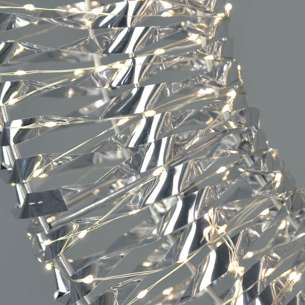 Close up of silver Christmas wreath with warm white LED lights