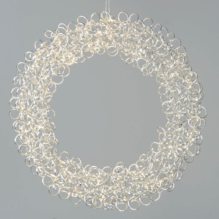 Large silver looped Christmas wreath with warm white LED lights