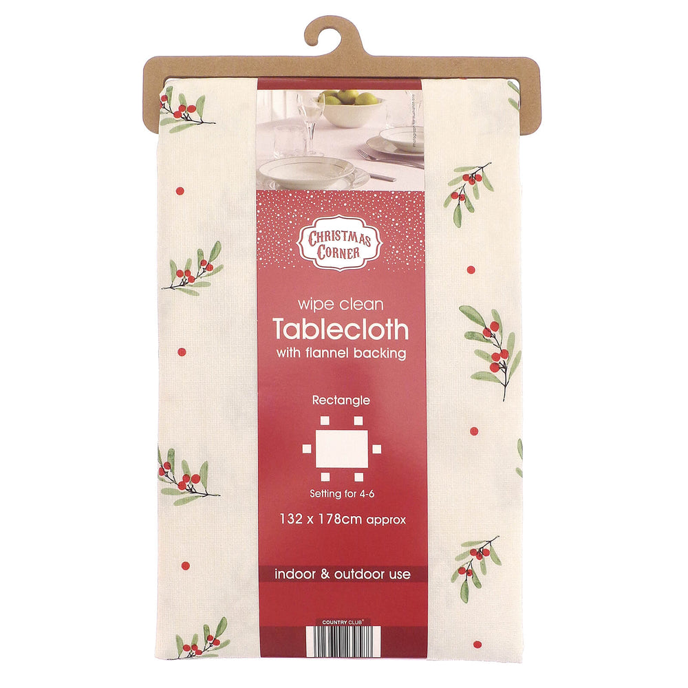Packaged Christmas-themed tablecloth with holly design on a white background