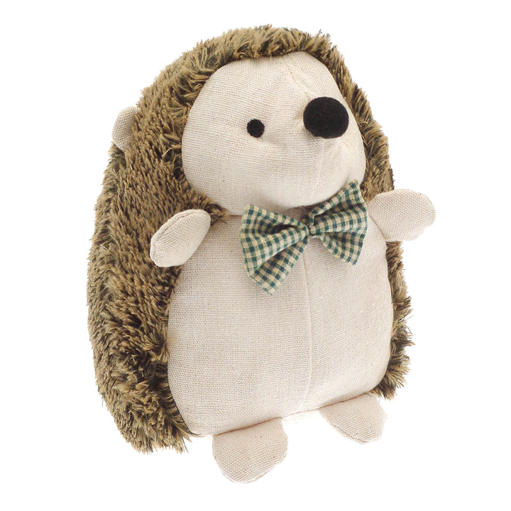 Plush hedgehog door stopper with a bow tie on a white background
