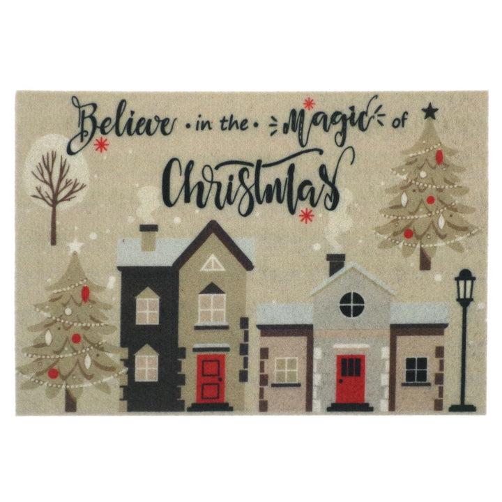 Decorative mat with Christmas-themed text "believe in the magic of christmas" and houses illustration