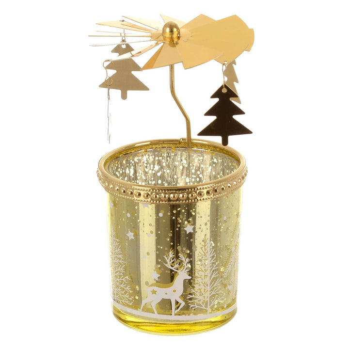 Decorative rotating carousel candle holder with gold accents and Christmas-themed design on a white background