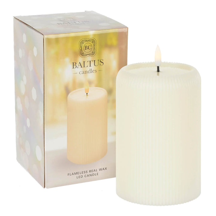 Flameless candle beside box packaging