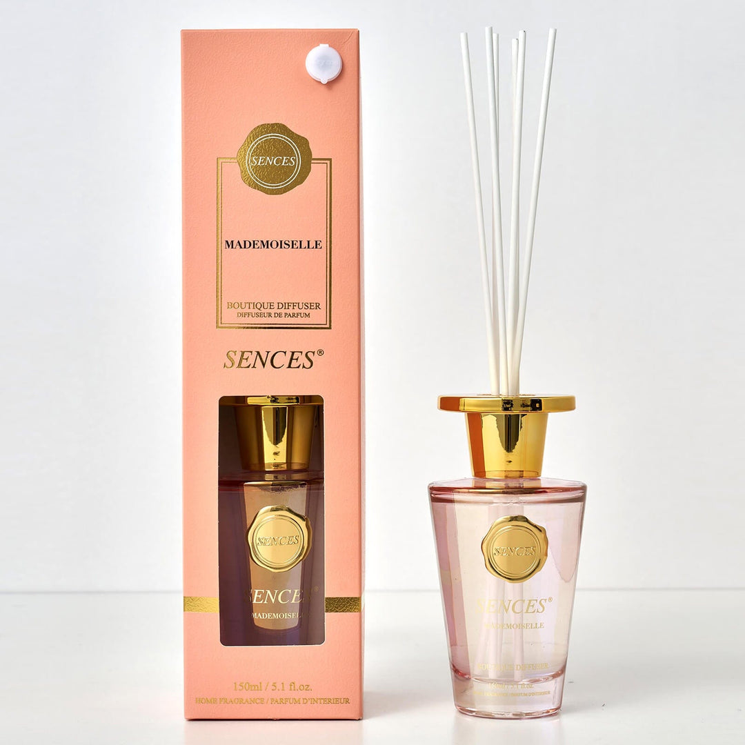 Sences Mademoiselle reed diffuser bottle and packaging on a white background