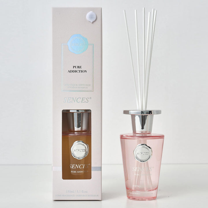 Sences Pure Addiction reed diffuser bottle with packaging on a white background
