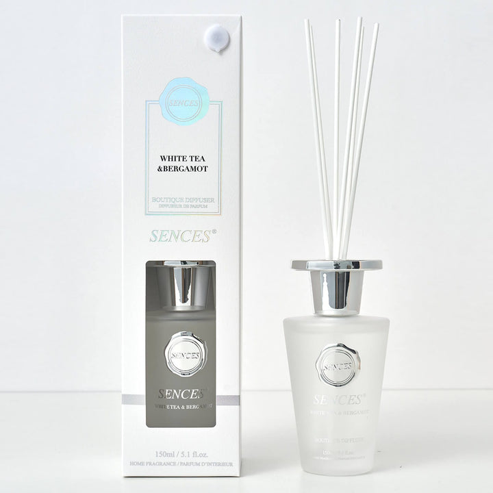 Sences White Tea & Bergamot Reed diffuser with frasted white glass bottle, white reeds and gift box packaging