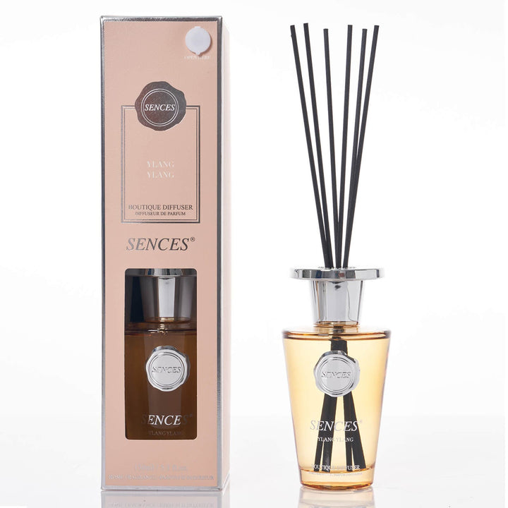 Sences Ylang Ylang Reed diffuser with pale orange glass bottle, black reeds and gift box packaging