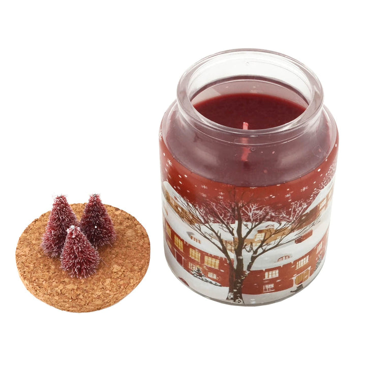 Red Christmas candle in a jar with a winter scene design on a white background