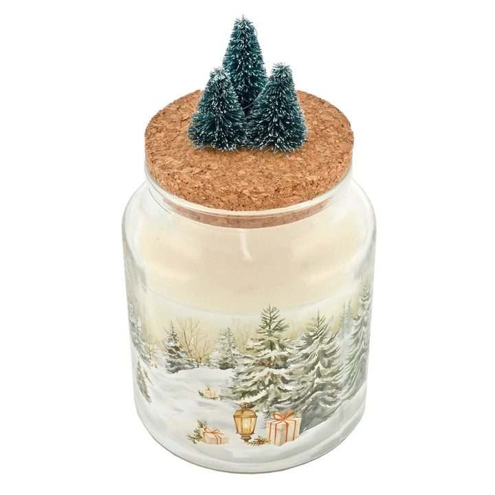 Christmas candle glass jar with cork lid featuring a winter scene and small Christmas trees.