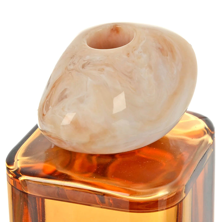 Peach marbled top for an orange glass bottle