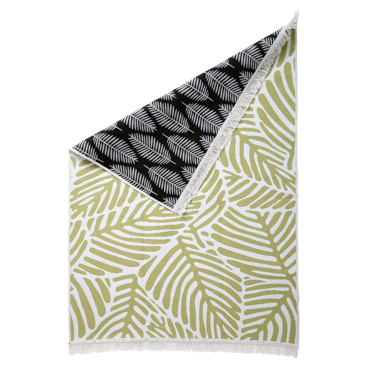 Green leaf and white pattern rug with black fern reverse