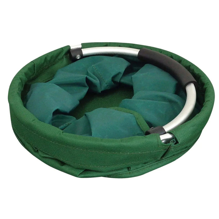 Folded green storage bag with silver handle