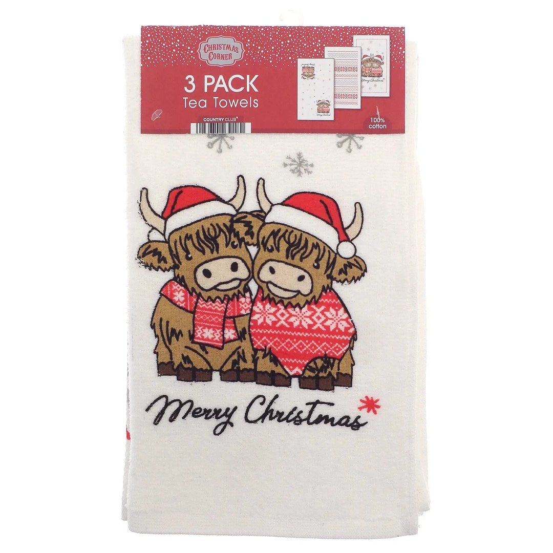 Pack of 3 tea towels with Highland Cow in snowflake jumper and scarf saying Merry Christmas