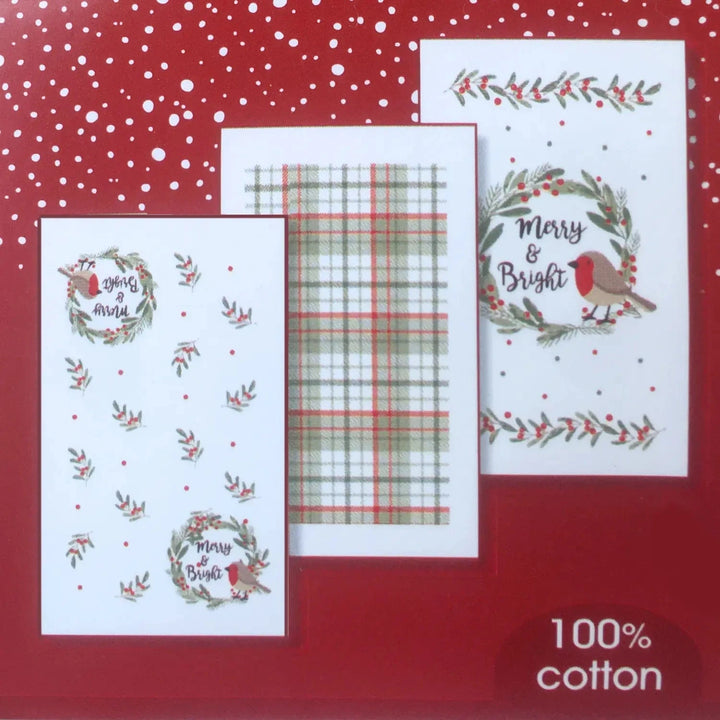 Set of Christmas-themed tea towelson a red background with 'Merry & Bright' text.