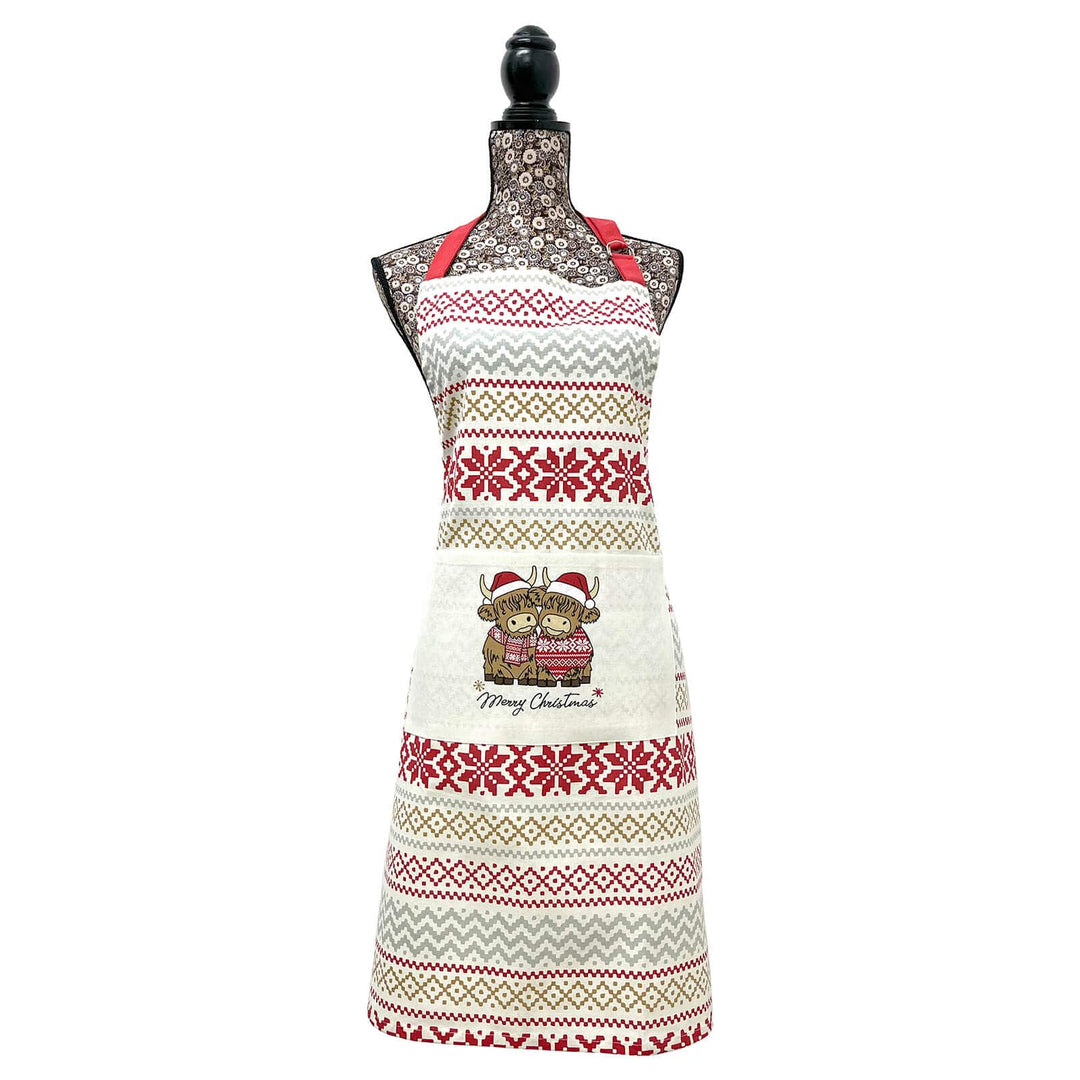 Christmas apron with Merry Christmas Highland cows and a nordic snowflake pattern