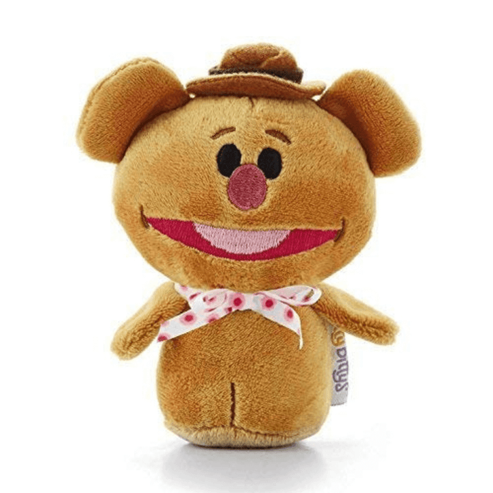 fozzie from the muppets Plush toy bear with a cowboy hat and pink bow tie on a white background