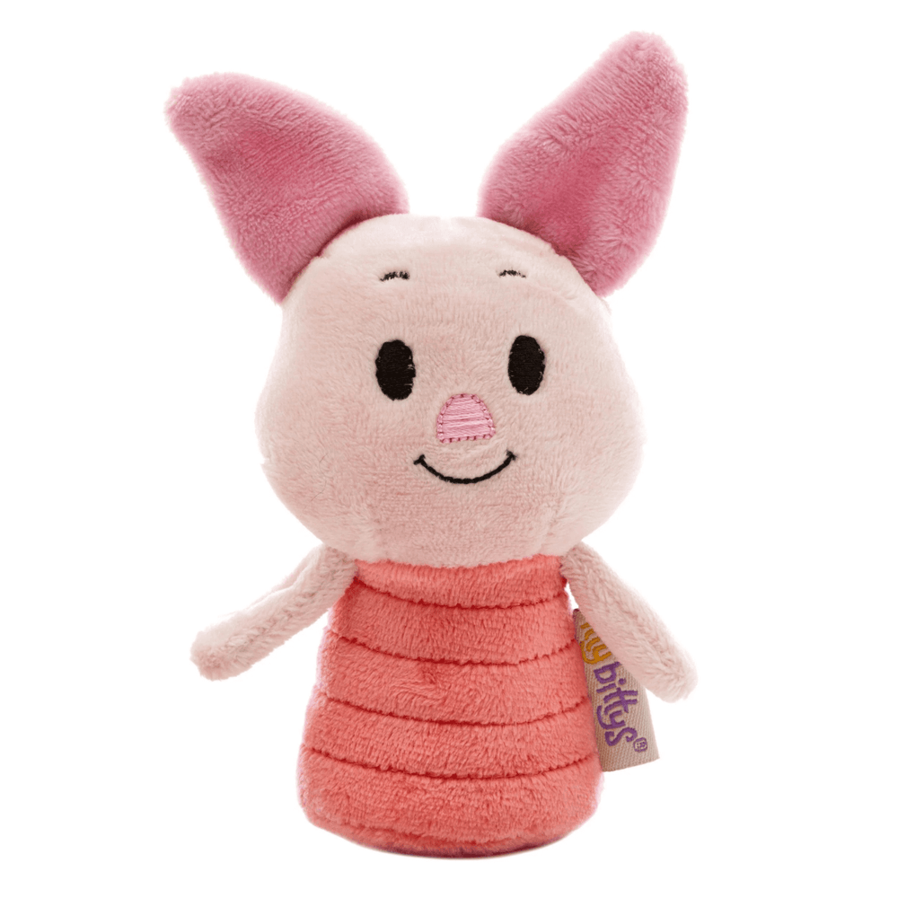 Plush toy of a pink piglet character with a tag on a white background