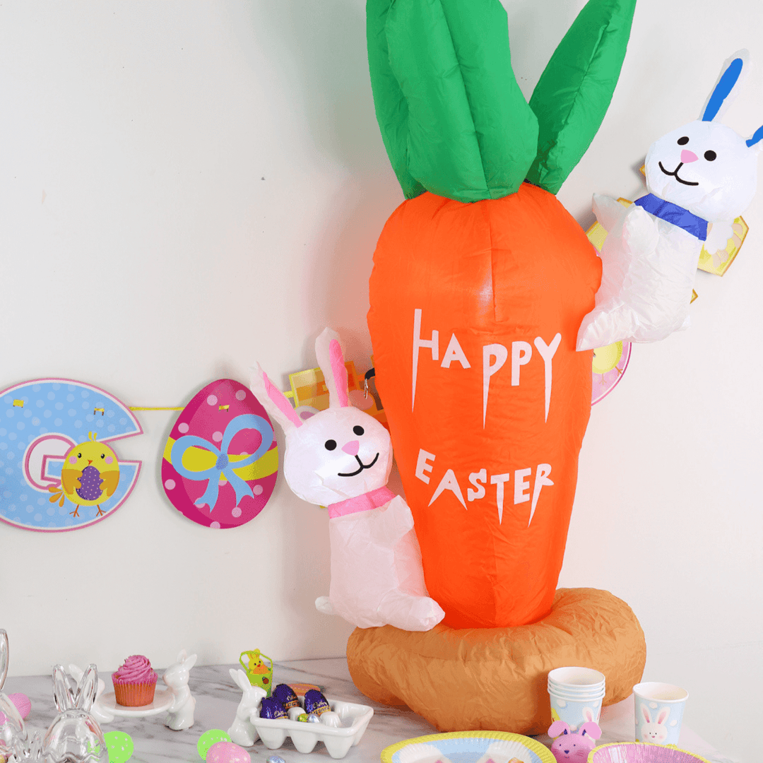 easter inflatable on a party table with easter eggs and cupcakes