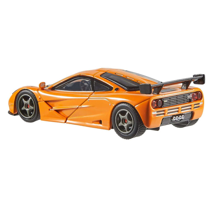 Rear view of an orange McLaren F1 GTR racing car model for collectors