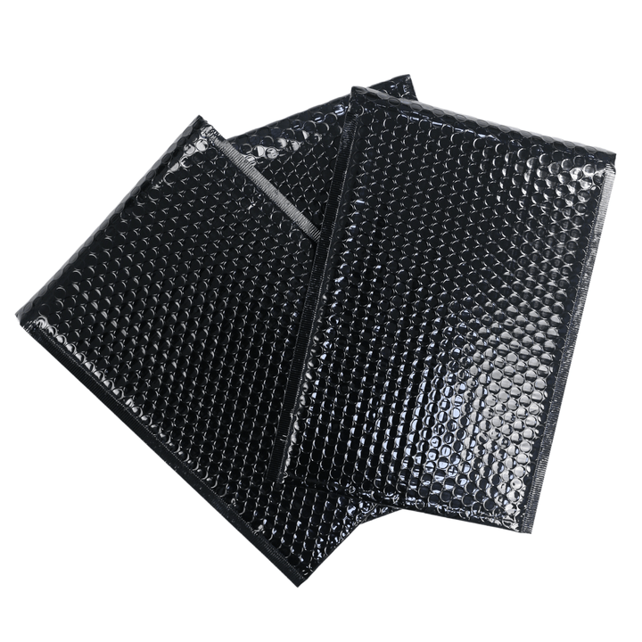 front view of 3 black bubble mailers on white background