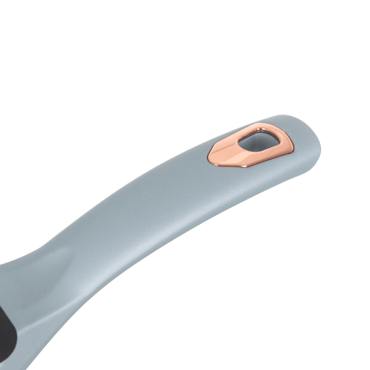 blue wok with a rose gold handle on a white background