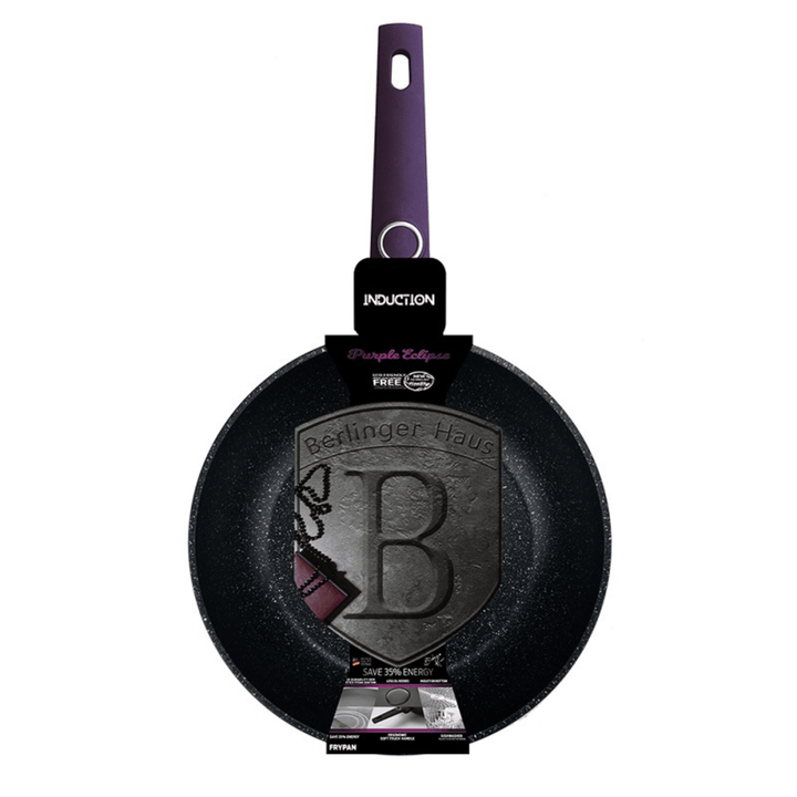 Black frying pan with purple handle on a white background