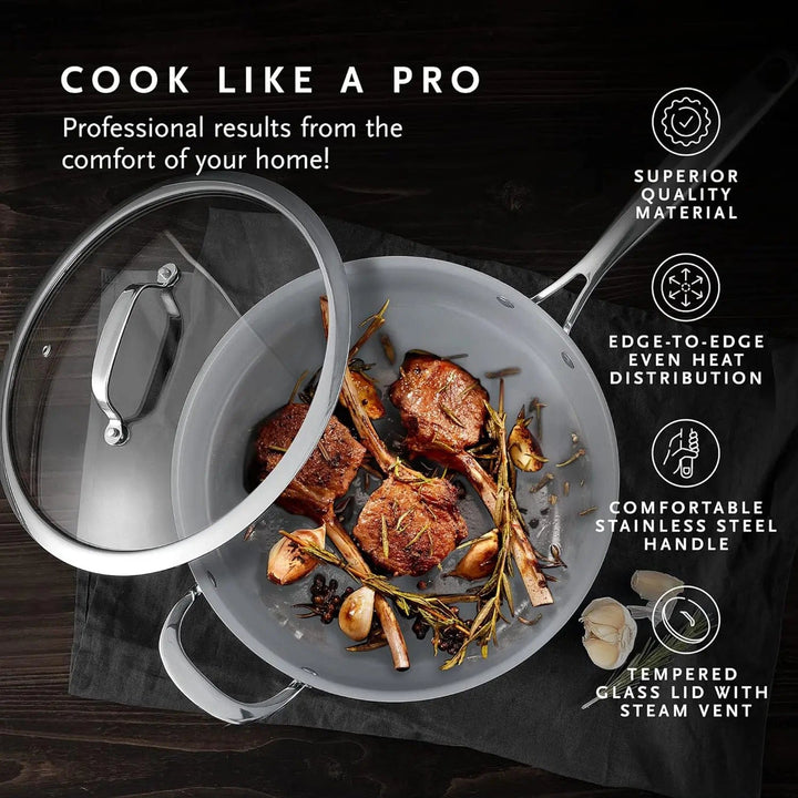 Top view of a frying pan with fried lamb chops, garlic and rosemary