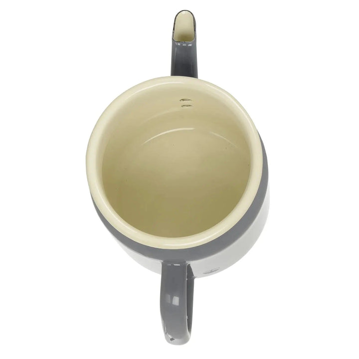 Overhead view of a grey coffee pot with lid off to show cream enamel inside