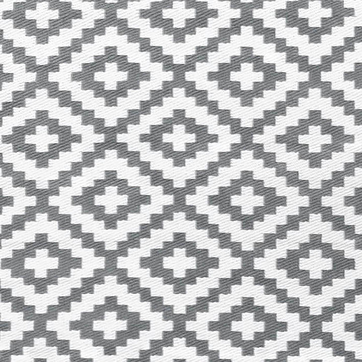 Grey and white diamond pattern woven plastic outdoor rug