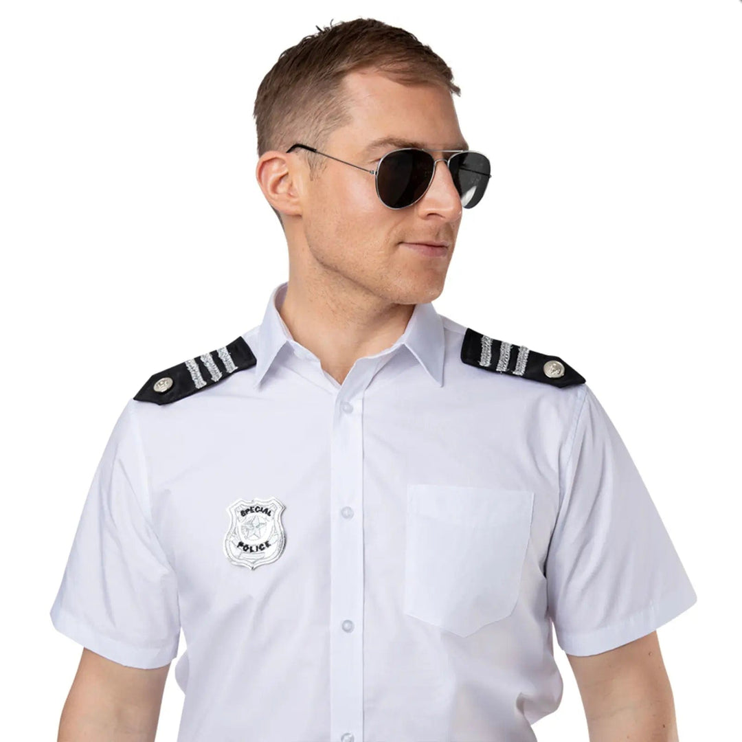 Man wearing black aviator sunglasses, special police badge and police shoulder epaulettes for fancy dress costumes