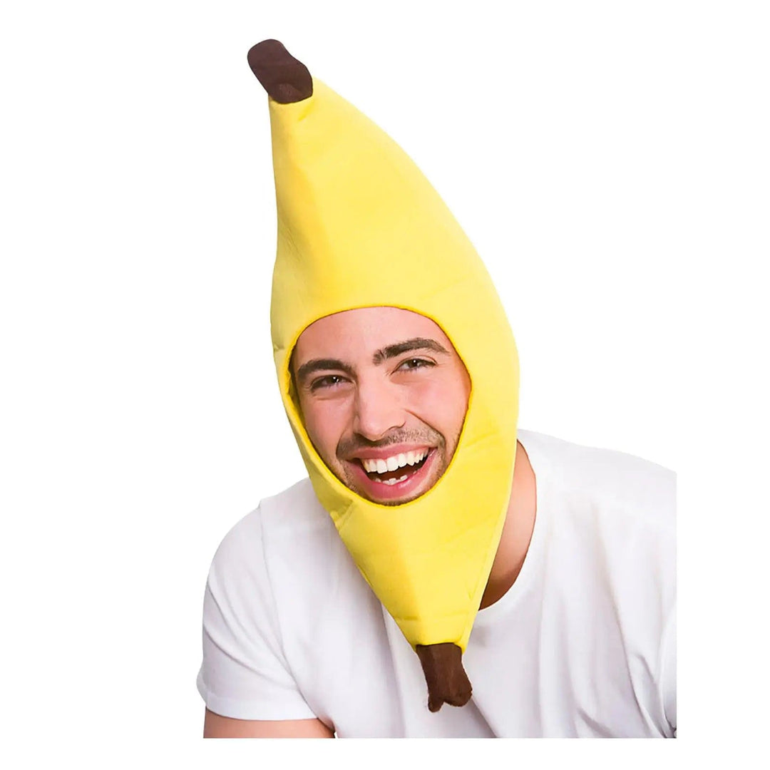 Man wearing a funny banana hat for food theme fancy dress costumes