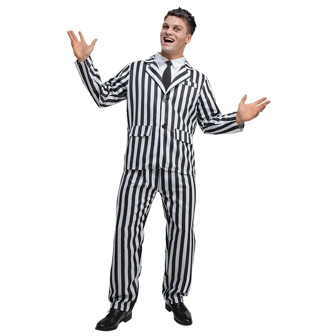 A person modeling a black and white striped suit with a white shirt and black tie, posing with hands raised and a smile on their face.