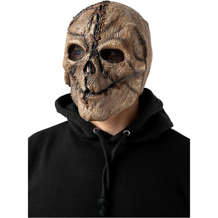 Adult wearing an evil scarecrow mask with jute cover and sticthing detail for Halloween fancy dress costumes